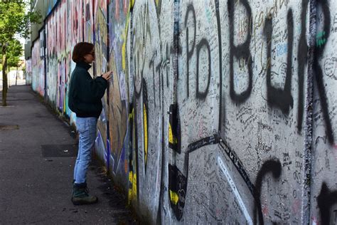 should graffiti be considered art or vandalism? does it reflect the society's values?